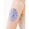Dexcom G6 Patch from Spring Collection on arm, floral design, durable adhesion.
