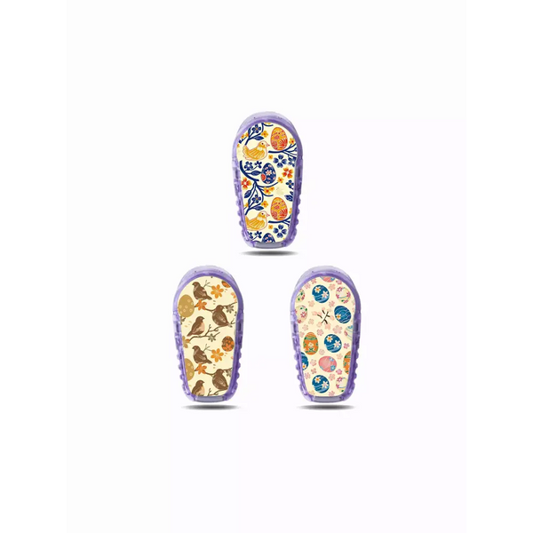 Three patterned baby shoes featured in Dexcom G6 Stickers - Easter Edition 2025