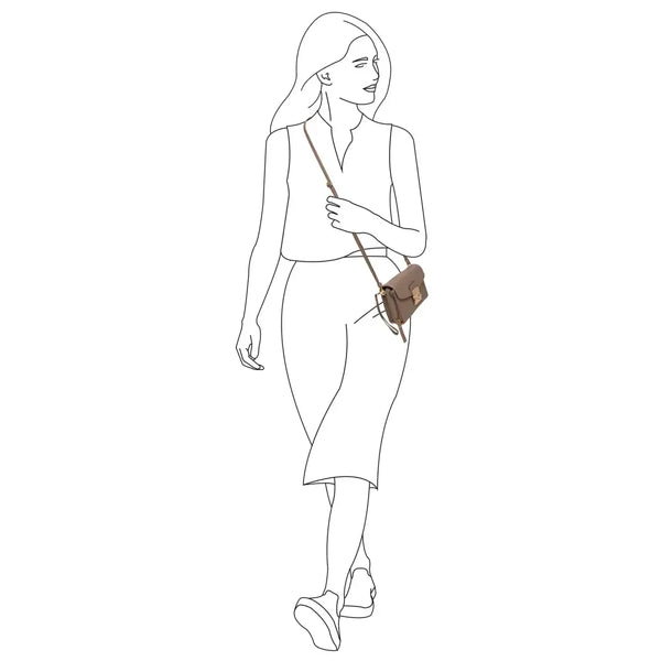 Woman wearing a taupe feminine leather shoulder bag for diabetics with adjustable strap, designed for diabetes care storage and daily use.