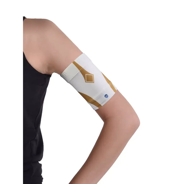 Glucose monitor and insulin pump armband worn on upper arm with white and gold design for secure diabetes device placement