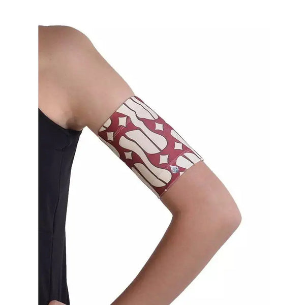 Armband securing blood glucose monitor with stylish pattern.