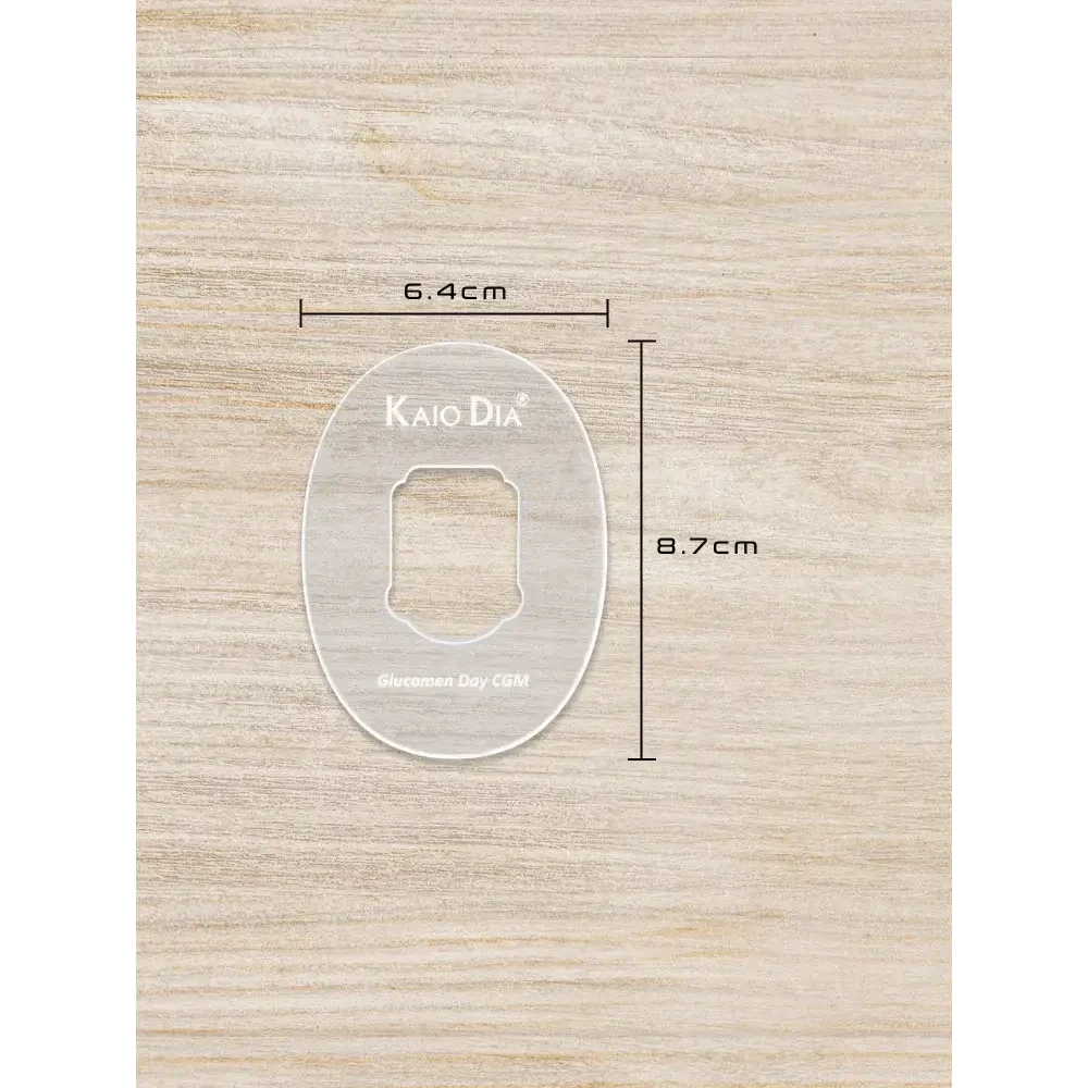 CGM sensor patch template on wooden surface with dimensions 6.4cm by 8.7cm, made from durable clear acrylic for precision cuts.