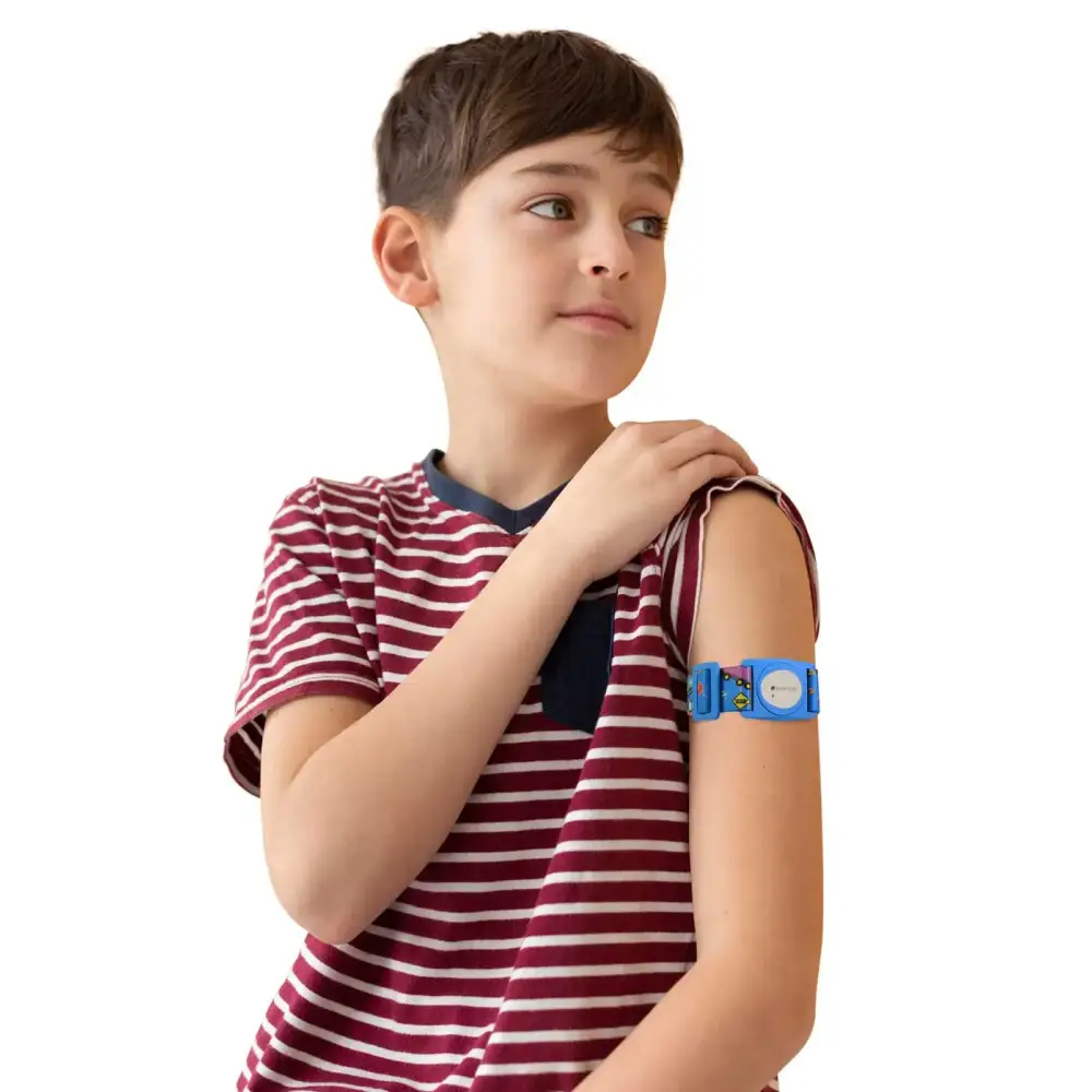 Child in a red and white striped t-shirt wearing a Dexcom G7 sensor Dia-Style armband