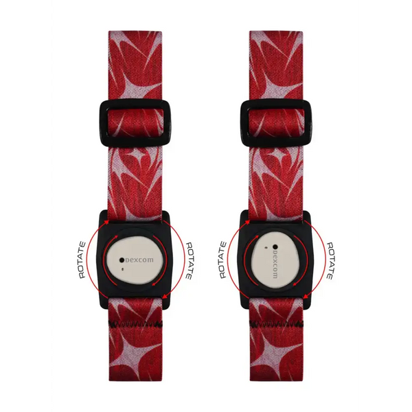 Red patterned Dexcom G7 Armband with rotating clip, featuring black buckles and white faces