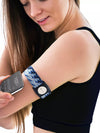 Dexcom G7 Armband with Rotating Clip in blue pattern, worn by woman for secure sensor placement.