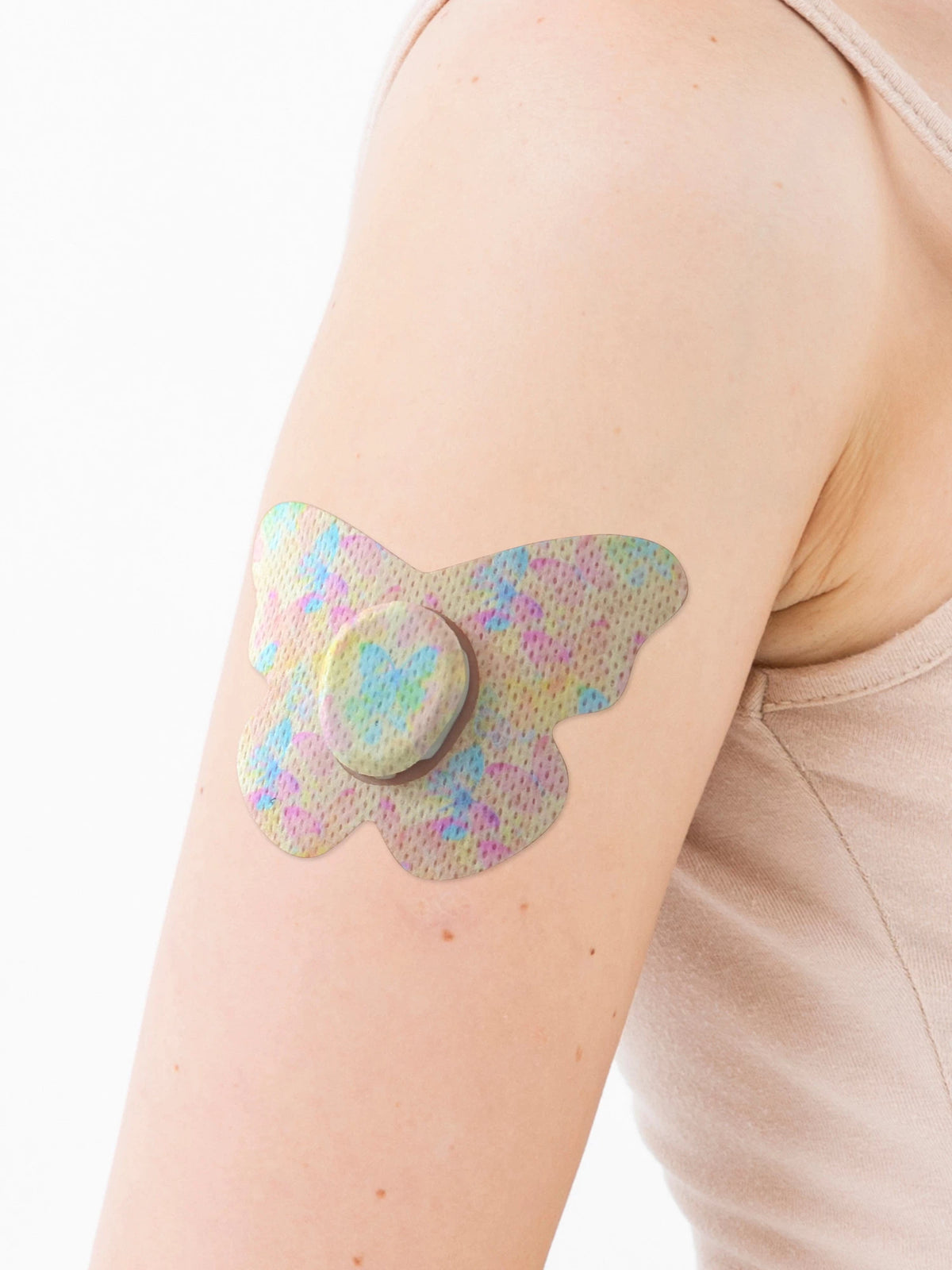 Dexcom G7用 固定パッチ、蝶型、腕に装着、クローズアップ
