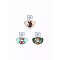 Three decorative Christmas-themed fragrance bottles for Guardian Enlite Stickers