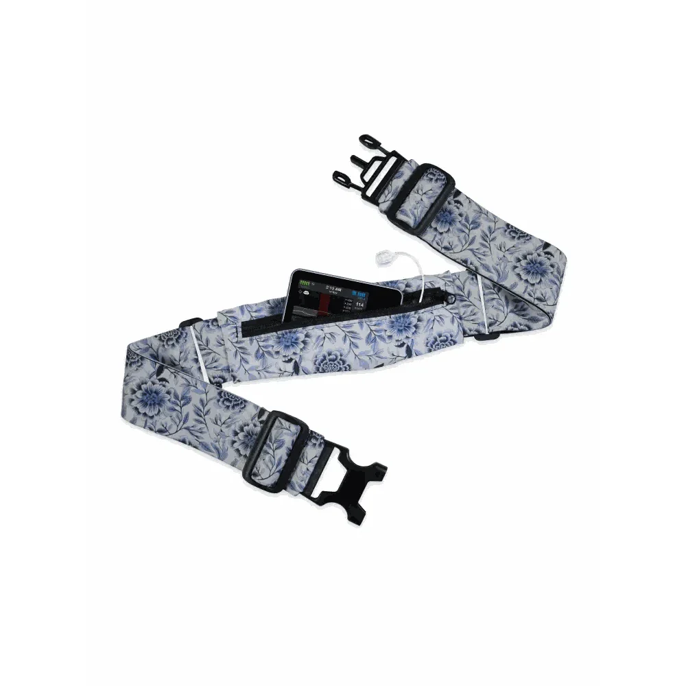 Insulin pump belt with a floral pattern, featuring adjustable straps and a transparent window for easy monitoring.