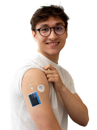 Blue Dia-Mobi Clip holding a Tandem Mobi insulin pump on the upper arm